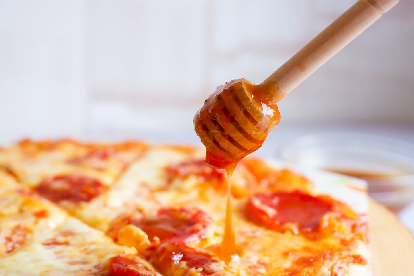 Hot Honey Sauce drizzled on Pizza